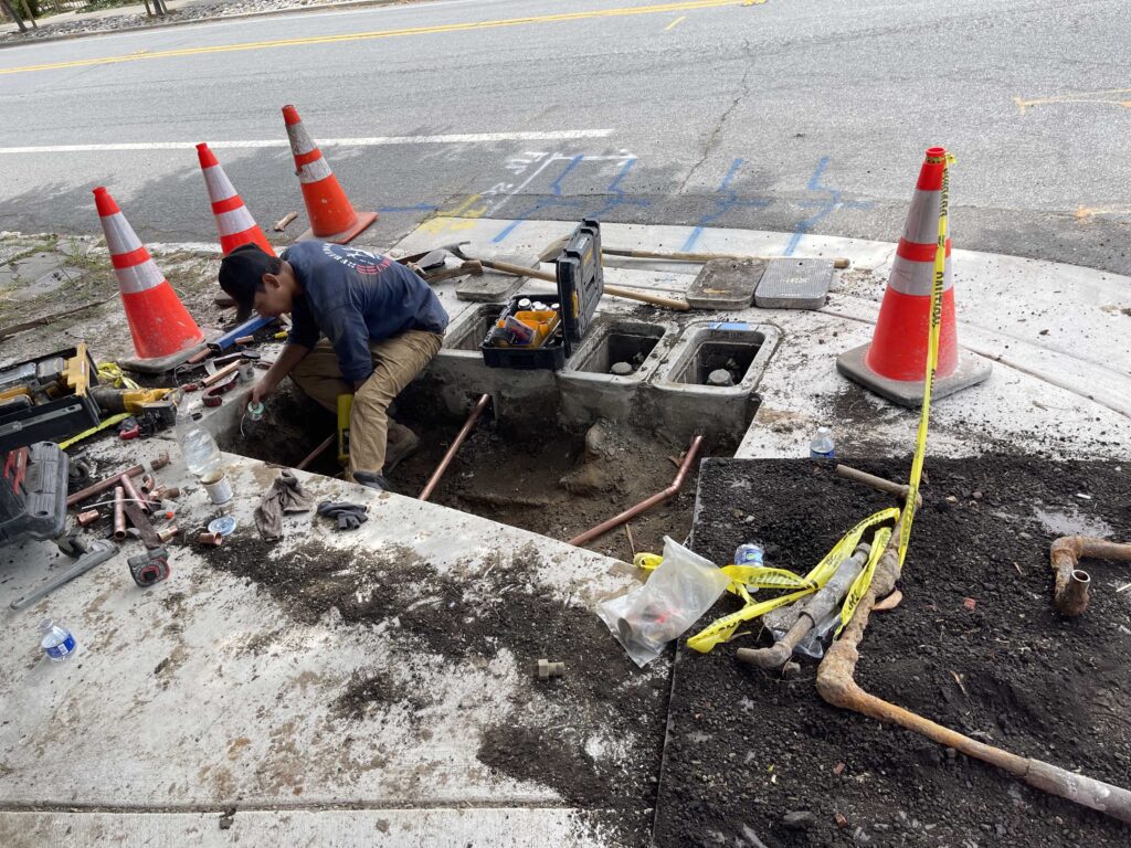 Making the connections to water meters.