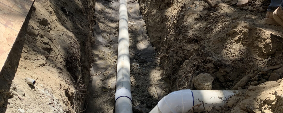 Storm Drain over a French Drain (sub-drain)