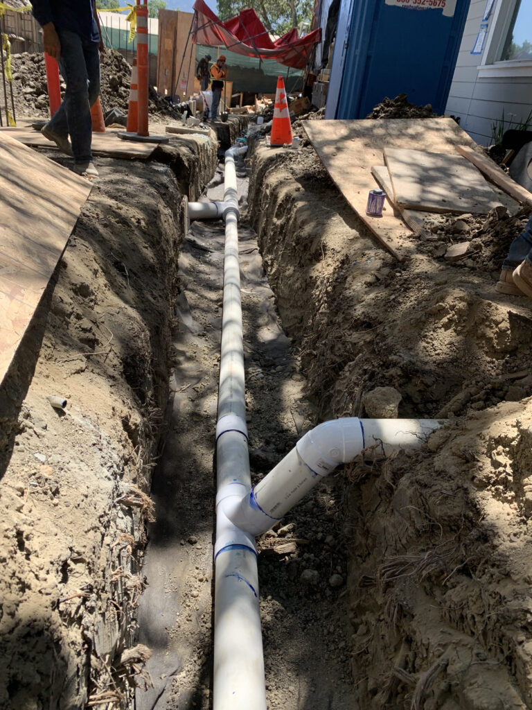 Storm Drain over a French Drain (sub-drain)